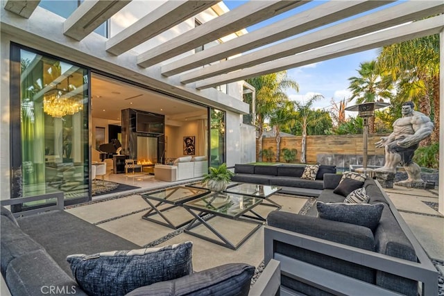 view of patio featuring an outdoor hangout area, a pergola, and fence