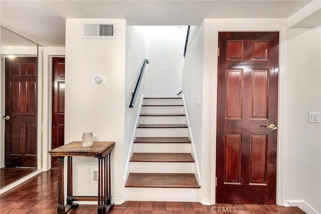 staircase with parquet floors