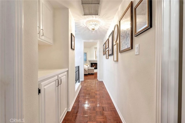 corridor with dark parquet flooring