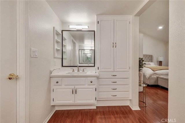 bathroom featuring vanity and hardwood / wood-style floors