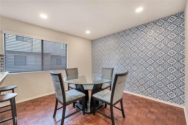 dining space with dark parquet floors