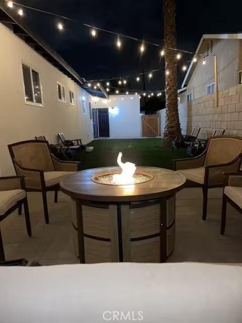 view of patio / terrace with a fire pit