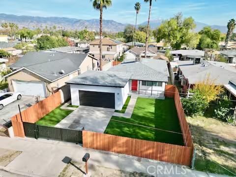 birds eye view of property with a mountain view