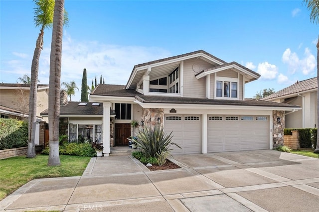 view of front of property featuring a garage and a front yard