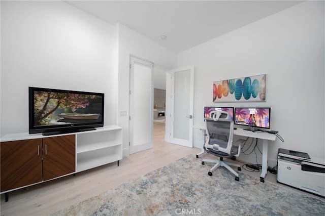 office area with french doors and light wood-type flooring