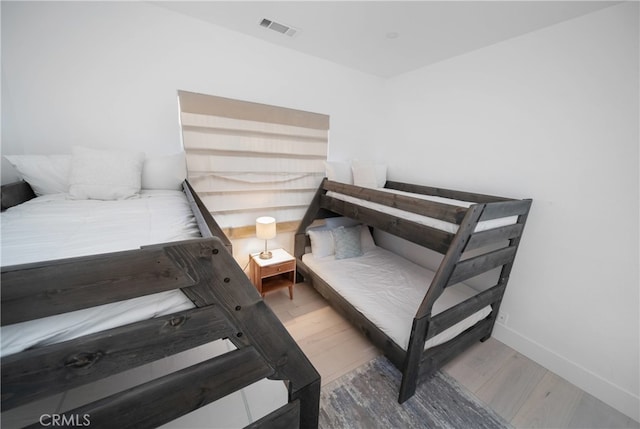 bedroom with hardwood / wood-style flooring