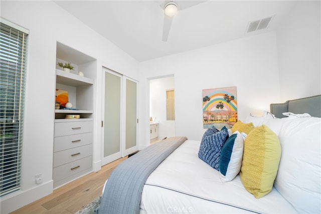 bedroom with ceiling fan and light hardwood / wood-style flooring