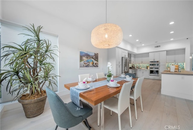 dining room with light hardwood / wood-style floors