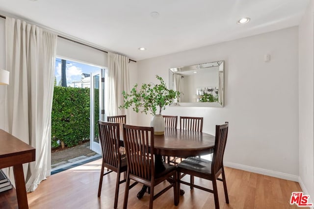 dining area with light hardwood / wood-style floors