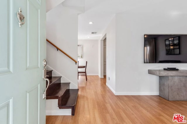 foyer entrance with wood-type flooring