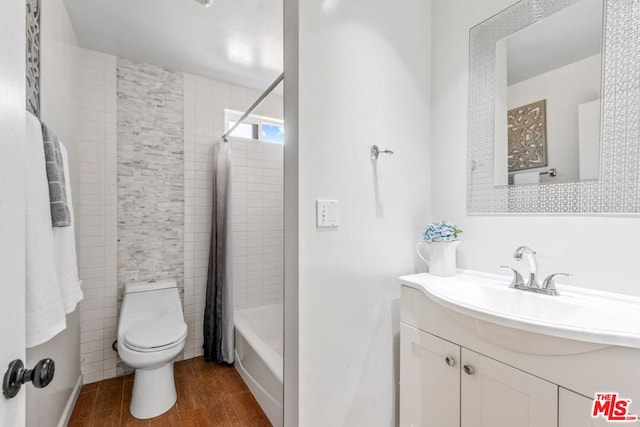 full bathroom featuring tile walls, hardwood / wood-style floors, toilet, vanity, and shower / bathtub combination with curtain