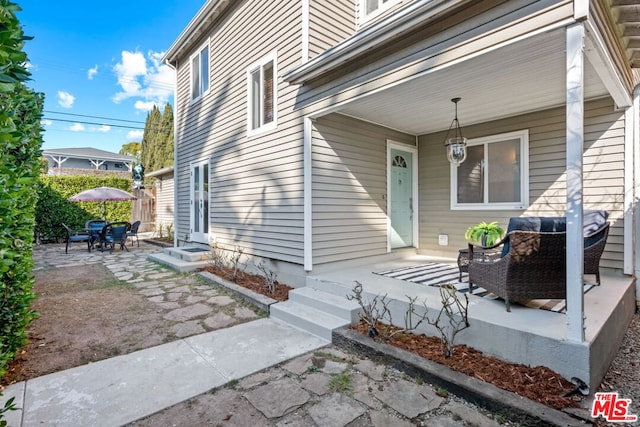 property entrance with a patio area