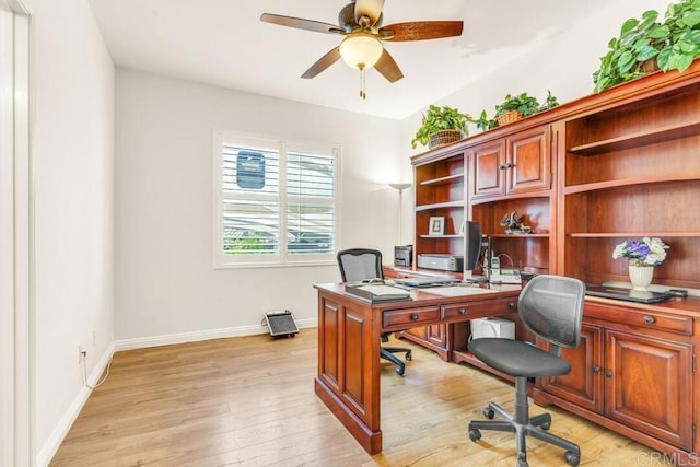 office with ceiling fan and light hardwood / wood-style floors