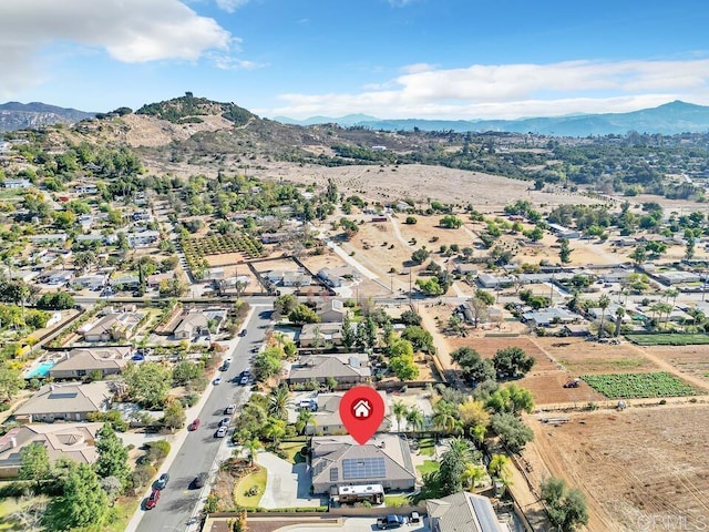 birds eye view of property featuring a mountain view