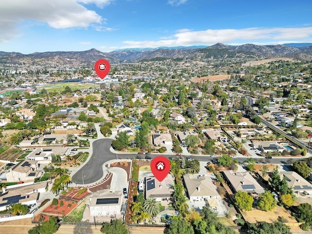 birds eye view of property featuring a mountain view