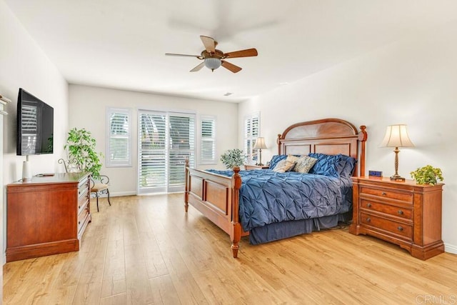 bedroom with access to exterior, ceiling fan, and light hardwood / wood-style flooring