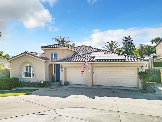 mediterranean / spanish-style house featuring a garage