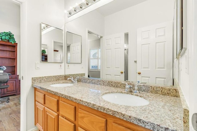 bathroom featuring vanity and hardwood / wood-style flooring