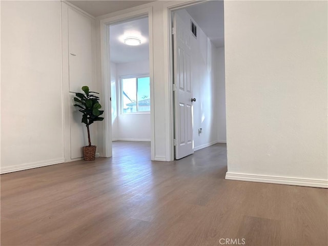 spare room with dark hardwood / wood-style flooring