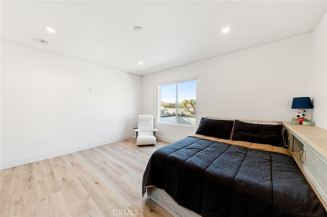 bedroom featuring light hardwood / wood-style floors