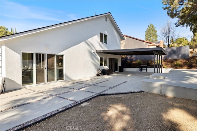 rear view of property with a patio area