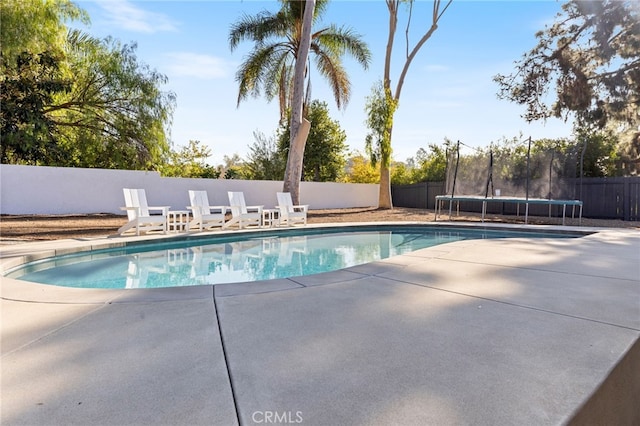 view of pool featuring a trampoline