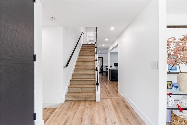 staircase featuring hardwood / wood-style flooring