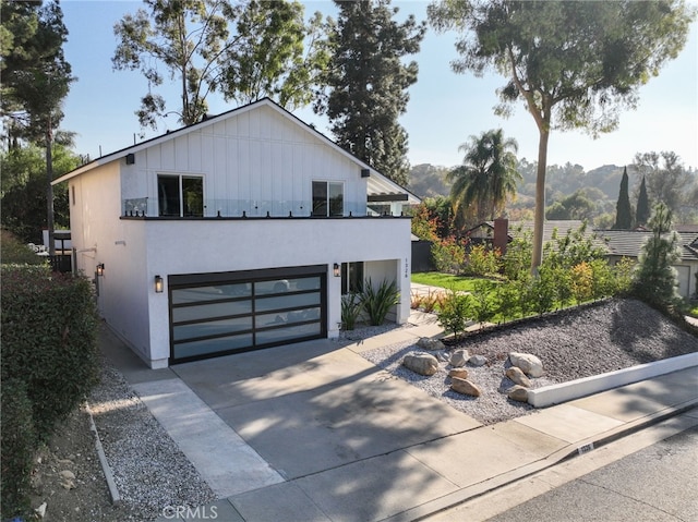 view of front of property featuring a garage and a mountain view