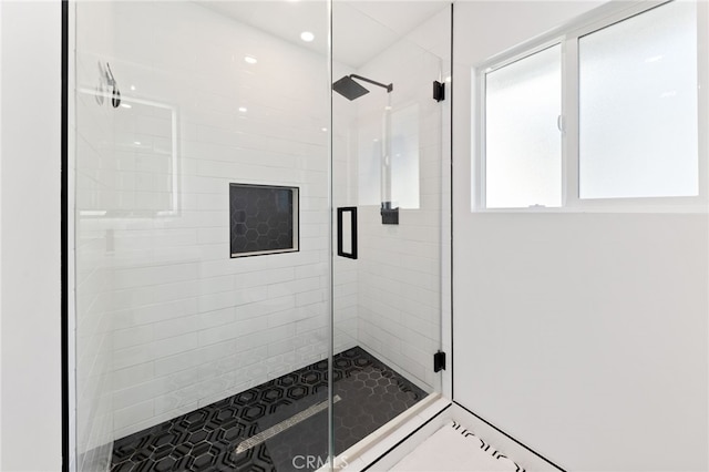 bathroom featuring tile patterned flooring and walk in shower