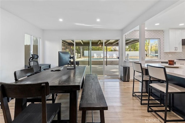 dining space with light wood-type flooring