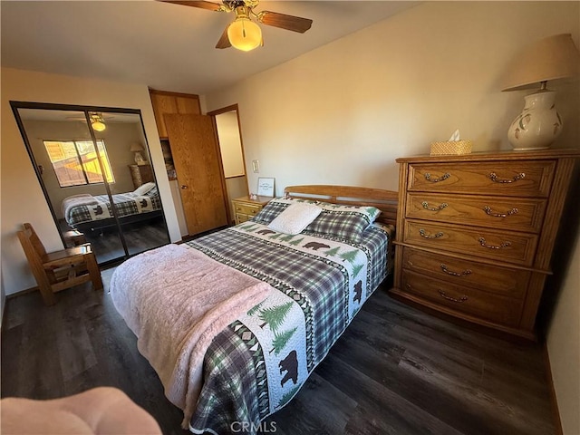 bedroom featuring ceiling fan, dark wood-type flooring, and a closet