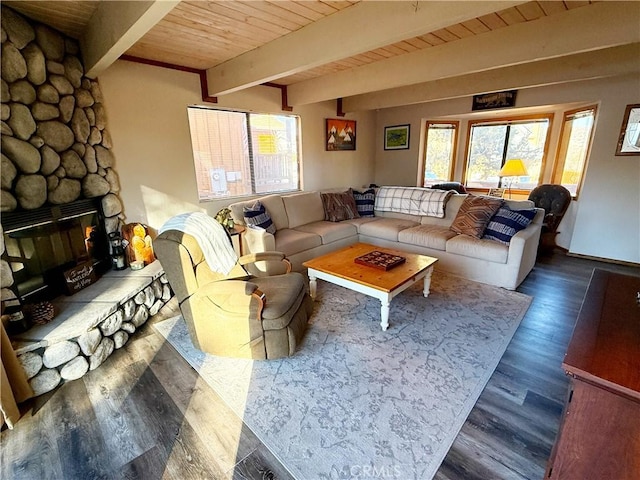 living room with wood ceiling, beamed ceiling, a wealth of natural light, and dark hardwood / wood-style floors