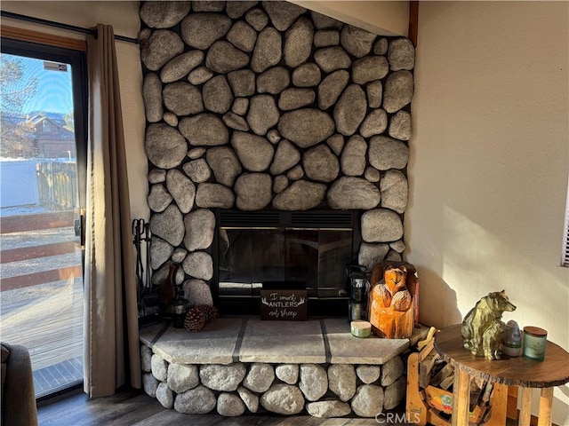 interior details with hardwood / wood-style flooring and a fireplace