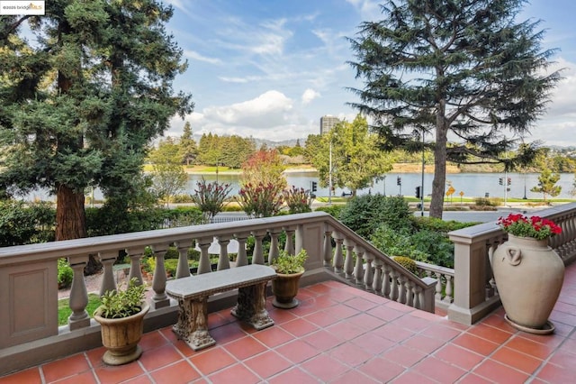 view of patio with a water view