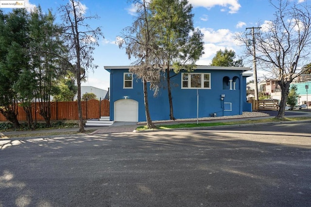 view of front of property featuring a garage