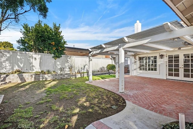 view of yard with a pergola, a patio area, and french doors