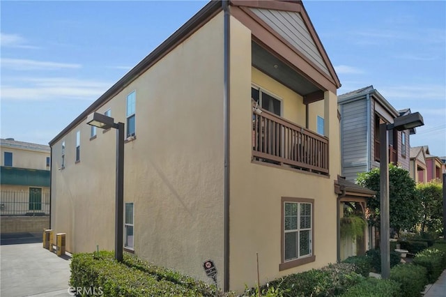 view of home's exterior featuring a balcony