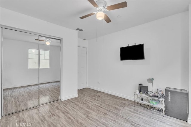 8856 Burnet Ave, North Hills, CA 91343 - unfurnished living room featuring wood finished floors, a ceiling fan, and an office area