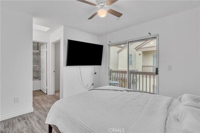 8856 Burnet Ave, North Hills, CA 91343 - bedroom featuring access to outside, wood finished floors, and ceiling fan