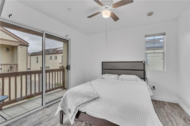 8856 Burnet Ave, North Hills, CA 91343 - bedroom featuring wood finished floors, access to outside, and ceiling fan