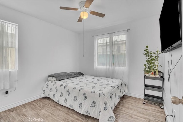8856 Burnet Ave, North Hills, CA 91343 - bedroom with wood finished floors and ceiling fan