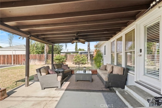 view of patio with an outdoor living space and ceiling fan