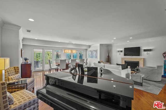 kitchen with light hardwood / wood-style floors and crown molding