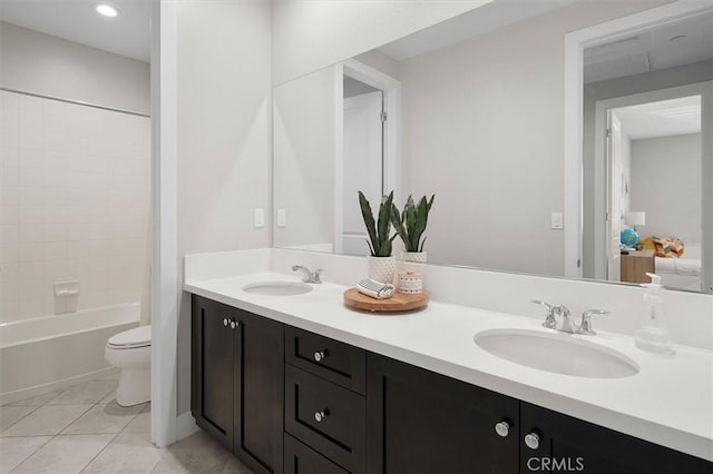 full bathroom with tile patterned flooring, vanity,  shower combination, and toilet