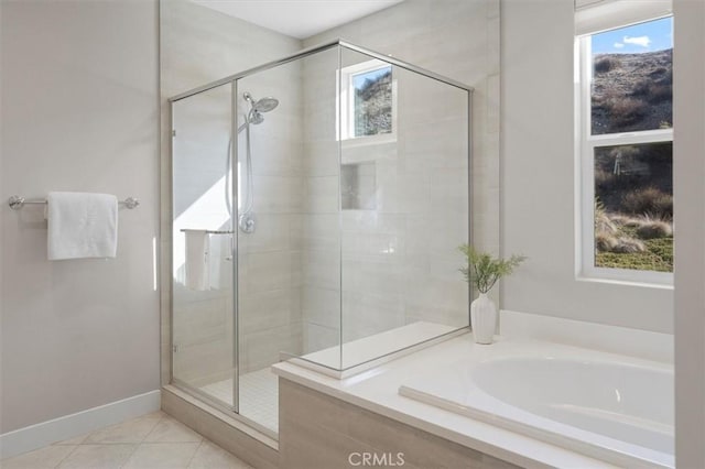 bathroom featuring independent shower and bath and tile patterned floors