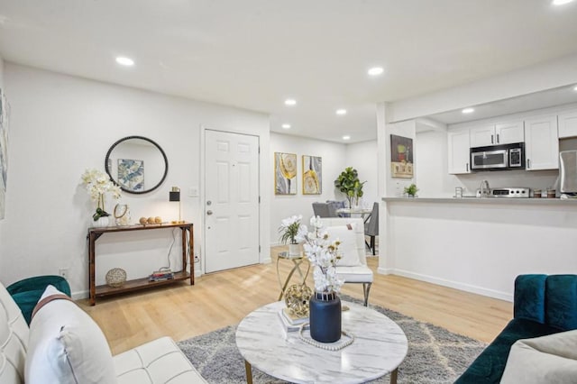 living room with light hardwood / wood-style floors