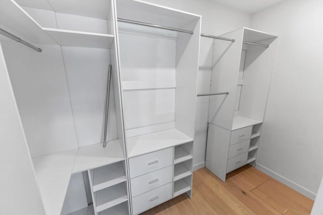 walk in closet featuring light wood-type flooring