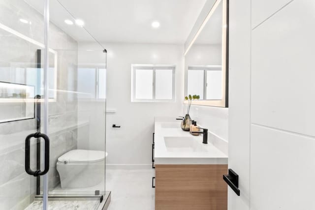 bathroom with vanity, toilet, and an enclosed shower