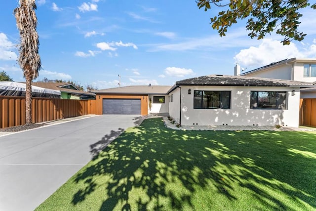 view of front facade with a garage and a front lawn