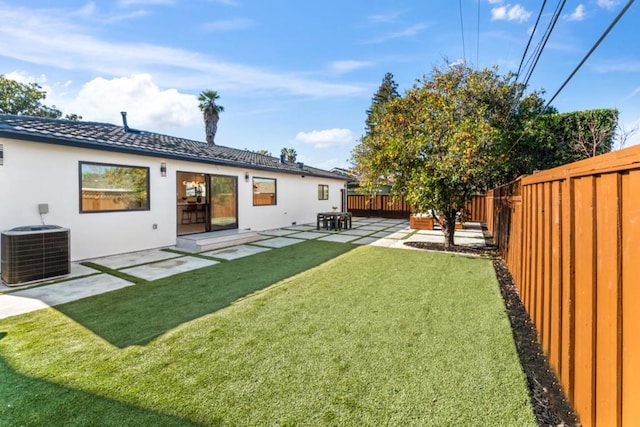 view of yard with a patio area and central AC unit